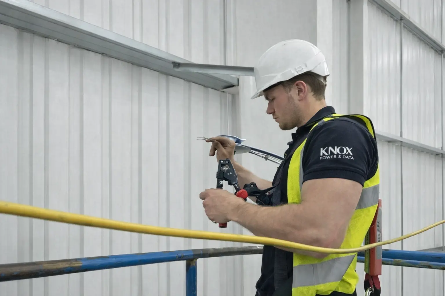 Knox Power and Data electrician working on data cabling in Wakefield